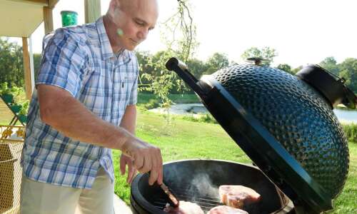 Hawkeye baseball coach shows off his grilling techniques with this…