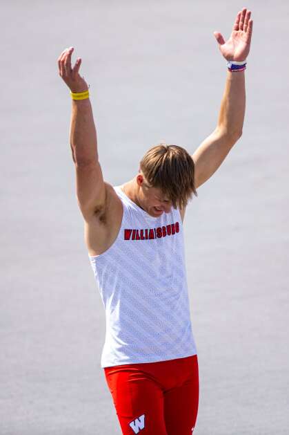Williamsburg’s Derek Weisskopf claps during the Class 2A boys’ state track and field high jump Friday at Drake Stadium in Des Moines. (Nick Rohlman/The Gazette)
