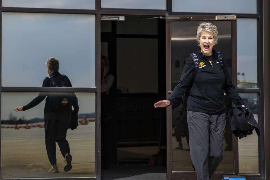 Hawkeyes’ head coach Lisa Bluder gets hyped ahead of her team’s plane ride on Thursday, March 28, 2024, at the Eastern Iowa Airport in Cedar Rapids, Iowa. The Hawkeyes are preparing to take on the University of Colorado on Saturday in the Sweet 16 of the NCAA Women’s Basketball Tournament. (Geoff Stellfox/The Gazette)
