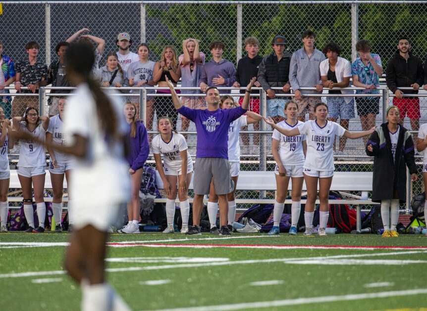 The Liberty sideline reacts after a call is ruled in favor of Marion in the second half of the game at Marion High School in Marion, Iowa on Thursday, May 25, 2023. (Savannah Blake/The Gazette)