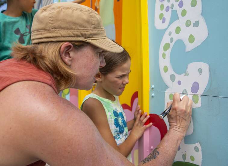 New paint-by-numbers mural depicts Wellington Heights’ vision