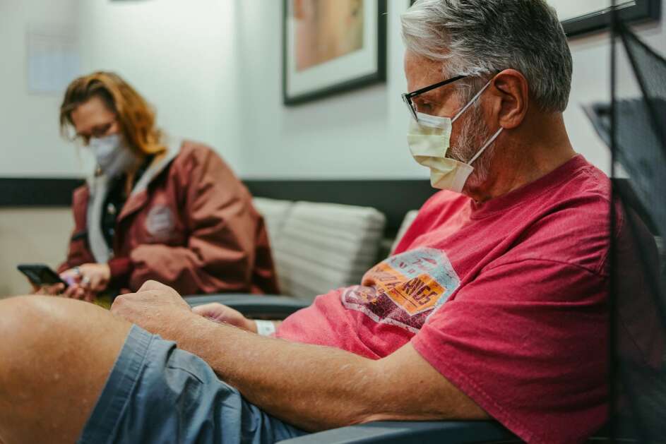 Gary and Beth Gray in a waiting room before Gary undergoes a procedure at the University of Kansas Medical Center in Kansas City, Kan., on Oct. 4, 2022. Gray, 64, has an autoimmune disorder that began shutting down his liver in 2019. MUST CREDIT: Chase Castor