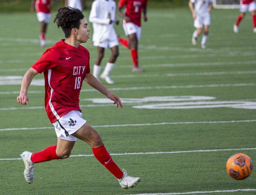 City High Little Hawks midfielder Josh Borger-Germann (18) drives the ball towards the Kennedy goal in the second half of the game at Iowa City High in Iowa City, Iowa on Tuesday, April 25, 2023. (Savannah Blake/The Gazette)
