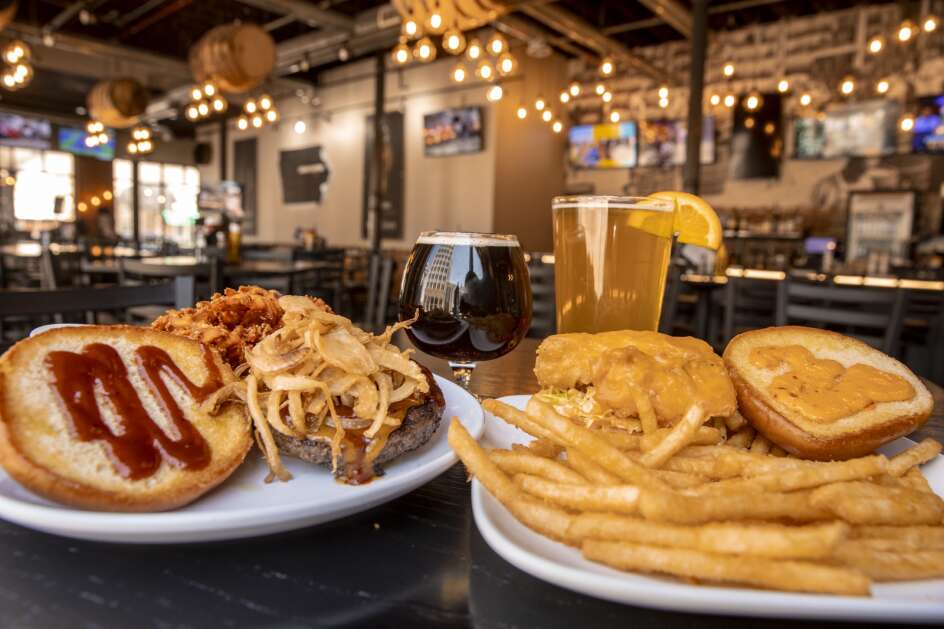 The Cowboy Burger with Kalona Lewbricator Dobbelbock (left) and Firecracker Fish Sandwich with Bent River’s Island Time Wheat beer (Barrel House’s house brew) at Barrel House’s location in Cedar Rapids, Iowa on Friday, April 28, 2023. (Nick Rohlman/The Gazette)