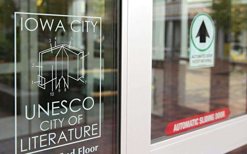 A decal for the Iowa City UNESCO City of Literature on the door of the Iowa City Public Library in Iowa City on Thursday, Oct. 12, 2017. (Stephen Mally/The Gazette)