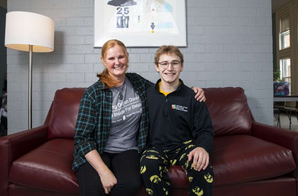 Kathi Anderson, left, and Christopher Turnis pose for a portrait Jan. 10 at the Ronald McDonald House in Iowa City. After learning Turnis needed a kidney, Anderson decided to get tested to see if she could donate. Through the National Kidney Registry, people may donate a kidney that isn’t a match to help a loved one, friend or stranger receive another kidney that is a match. Because Anderson donated a kidney, Turnis was able to get another kidney from a live donor elsewhere in the United States. (Savannah Blake/The Gazette)