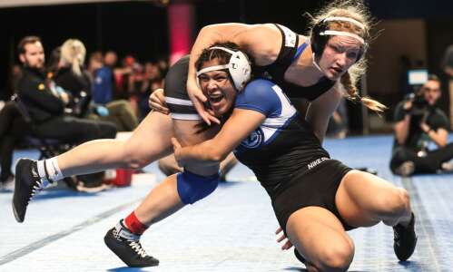 Photos: Girls’ wrestling regional tournament at Alliant Energy PowerHouse