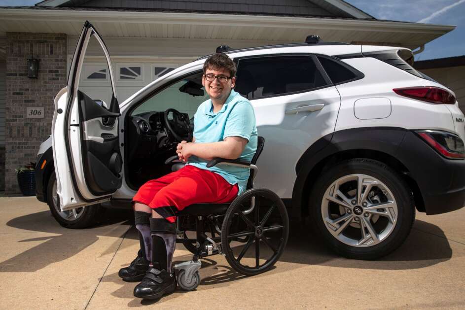 Max Stancel-Hess, a senior at Marion High School, poses May 10 for a portrait at his grandparent's home in Atkins. Stancel-Hess, who uses a wheelchair due to spina bifida, is learning to drive his family’s car and helping his grandfather build and fix things around the house. (Geoff Stellfox/The Gazette)