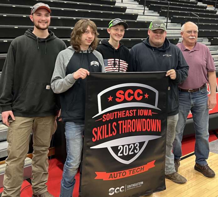 MPCHS Auto Team smile wide as they pose with their winning banner from the Skill Throwdown. Pictured: Palmer Snavely, Jason Shirkey, Aaron Moler, Tate Garmoe, and instructor Jerry Crouch. (Photo Submitted)