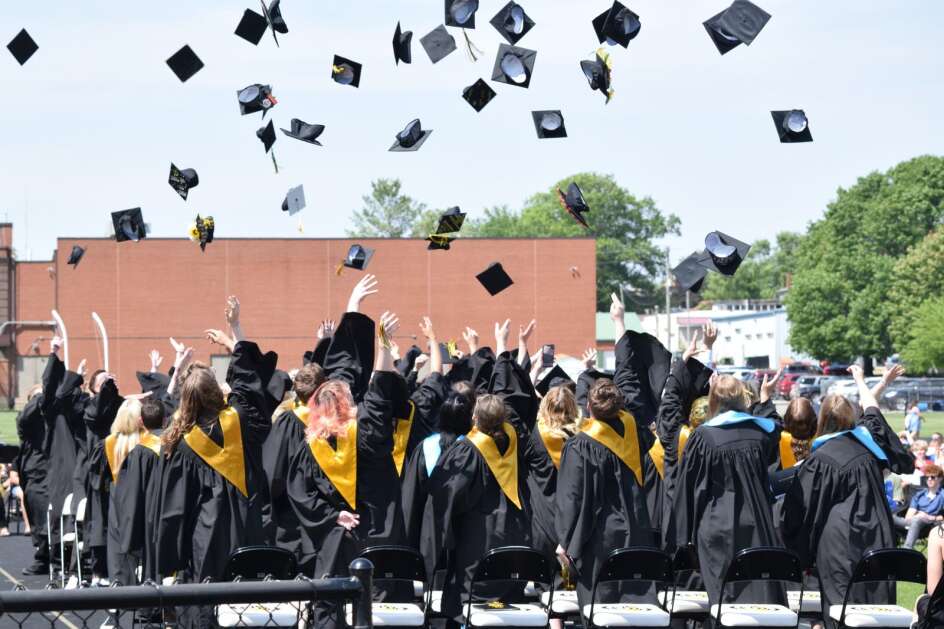 The New London class of 2023 throws their caps into the air after the graduation ceremony on Sunday, May 21, 2023. (Hunter Moeller/The Union)