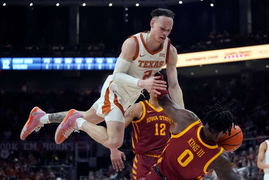 Texas guard Chendall Weaver (2) is fouled by Iowa State forward Tre King (0) on a drive to the basket during the second half of an NCAA college basketball game Tuesday, Feb. 6, 2024, in Austin, Texas. (AP Photo/Eric Gay)