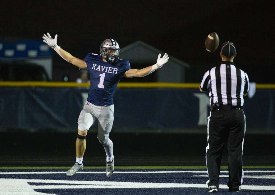 Xavier's Coleton Beasler-Weber (1) reacts after running the ball into the end zone for a touchdown in the fourth quarter against Western Dubuque at Xavier High School in Cedar Rapids, Iowa on Friday, Sept. 8, 2023.  (Savannah Blake/The Gazette)