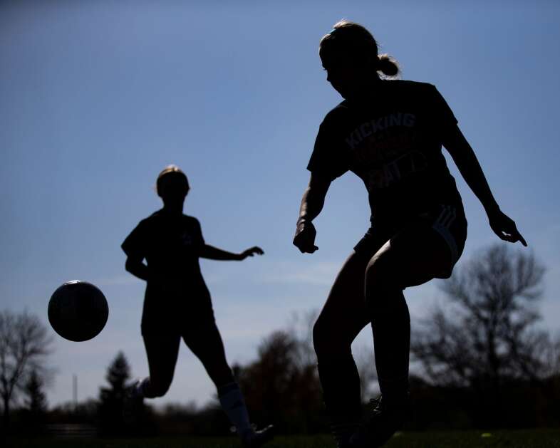 Solon junior Gabby Knipper (right) participates in a drill during a soccer practice at Solon High School in Solon, Iowa on Thursday, April 27, 2023. The high school is beginning a program where student-athletes will be able access sports-psychology resources. (Nick Rohlman/The Gazette)