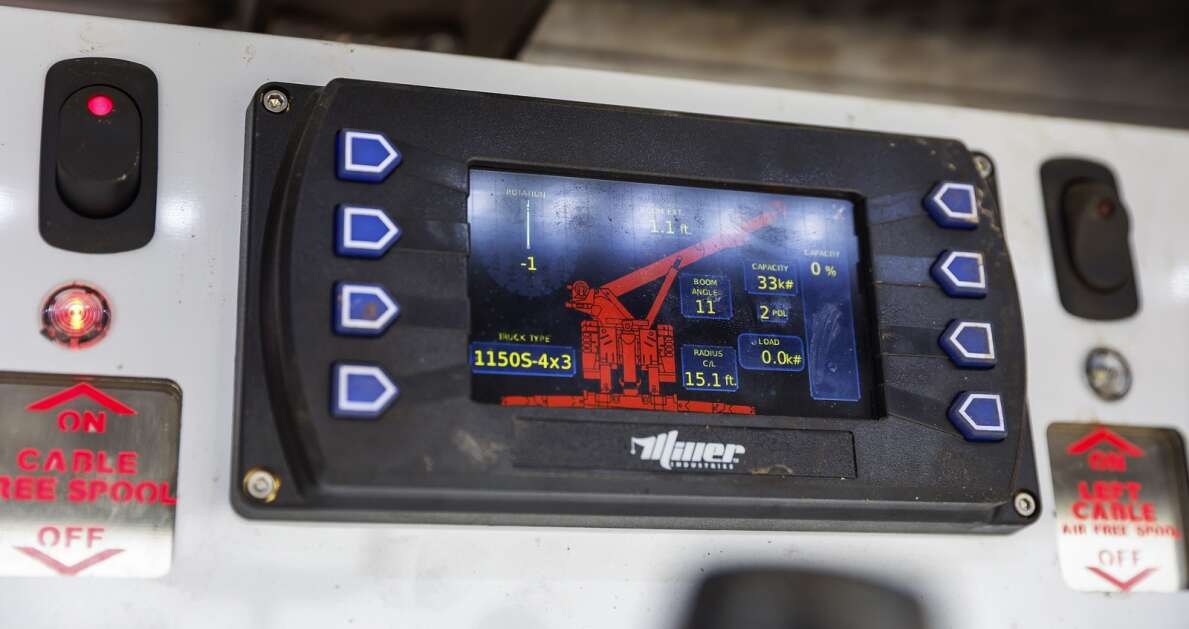 A digital display shows information like boom angle and extension as well as load weight as John Snodgrass with Papa's Truck & Trailer Repair demonstrates the capabilities of his 2022 Peterbilt Century rotator wrecker tow truck in southwest Cedar Rapids. (Jim Slosiarek/The Gazette)