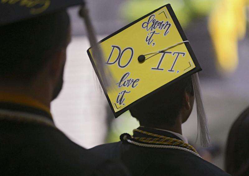 A graduate wears a decorated mortarboard during the University of Iowa College of Liberal Arts and Sciences and University College Spring 2018 Commencement at Carver-Hawkeye Arena in Iowa City on Saturday, May. 12, 2018. Nearly 12,000 students will graduate this weekend from Iowa’s three public universities. (Stephen Mally/The Gazette)