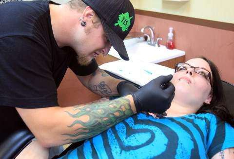 Iowa lacks oversight of body piercing