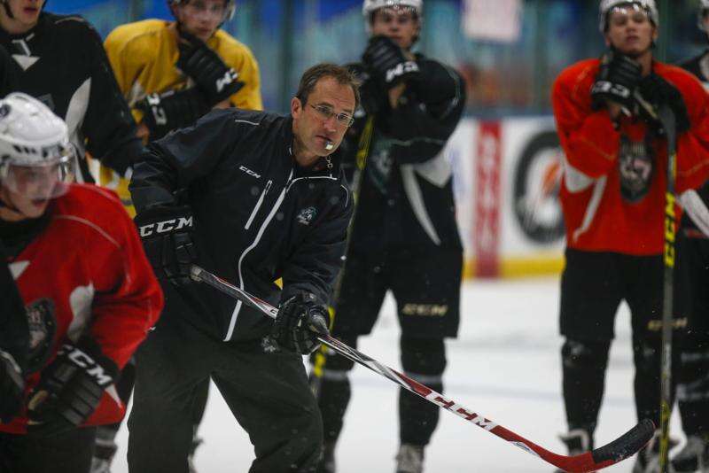 Cedar Rapids RoughRiders Head Coach Mark Carlson shoots a puck during a two-on-two drill at a team practice at the Cedar Rapids Ice Arena on Wednesday, September 23, 2015. (Andy Abeyta/The Gazette) ¬