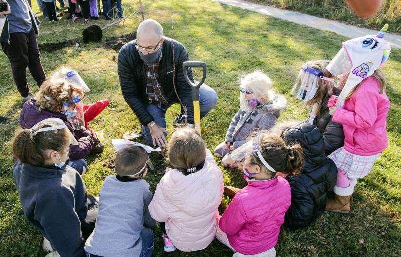 Cedar Rapids elementary students ‘plant hope’ with 6 apple trees in city park