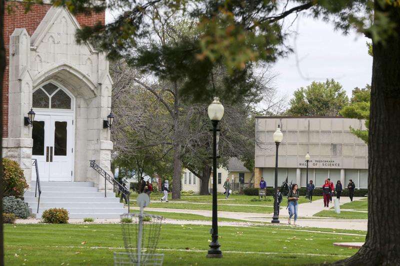 Students make their way Wednesday across campus at Iowa Wesleyan University. After the school announced that financial troubles might force it to close, leaders feared enrollment would drop. Actually, it has increased. (Rebecca F. Miller/The Gazette)