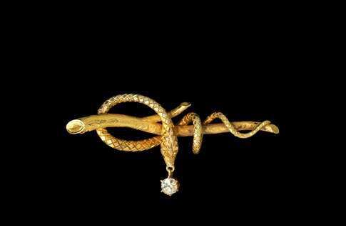 Madeleine Albright’s famous serpent pin, others in Cedar Rapids
