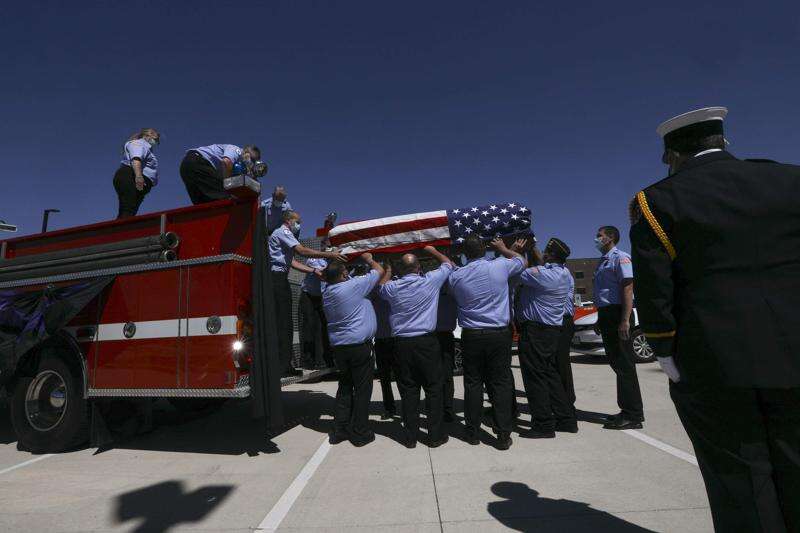 Fire truck parade for deceased Ely firefighter