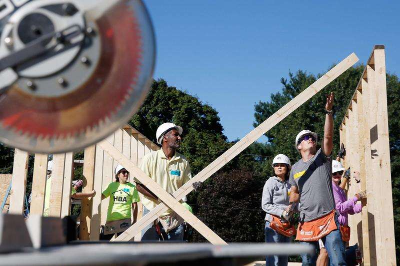 Volunteers help put up house as part of September 11 Day of Service in Iowa City