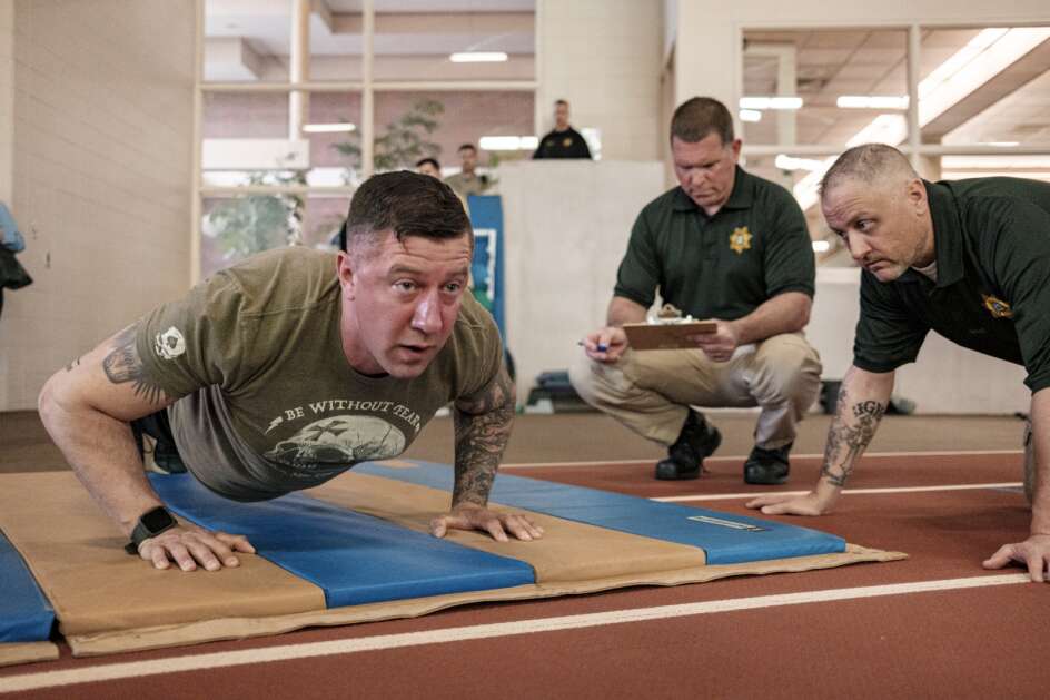 Chris Butterfield, 37, of Center Point, completes push-ups during testing Saturday for law enforcement applicants hosted by the Linn County Sheriff's Office at Coe College in Cedar Rapids. Like other police agencies across the nation, the Linn County Sheriff’s Office has seen a big drop off in applicants.  (Nick Rohlman/The Gazette)