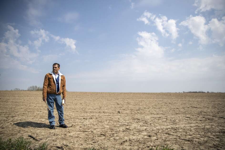 Max Chavez, a farmer and immigrant from Mexico, surveys his land as he decides where to plant this years crops on Tuesday, April 25, 2023, at his farmland in Carlisle, Iowa. Chavez, along with many other immigrant non-native English speakers in the agricultural and ranching community, has struggled to receive grants, loans and other funding opportunities. (Geoff Stellfox/The Gazette)