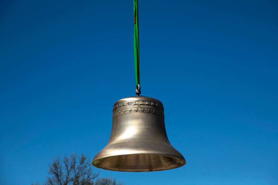 The second bell, weighing roughly 4,000 lbs is lifted off the ground on Wednesday, May 3, 2023, at the University of Northern Iowa in Cedar Falls, Iowa. (Geoff Stellfox/The Gazette)