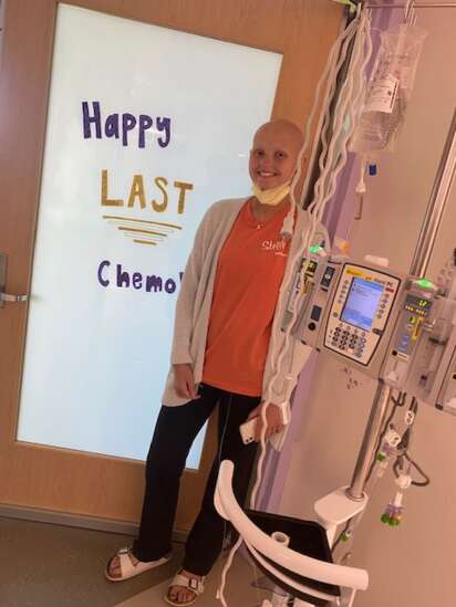 UIHC patient shown with ‘Last Chemo’ sign during Iowa Wave experiences ‘overwhelming’ weekend of support