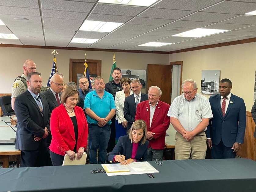 Iowa Gov. Kim Reynolds signs House File 595 into law, increasing penalties for fentanyl sales and providing a drug that results in an overdose. (Caleb McCullough/Gazette-Lee Des Moines Bureau)
