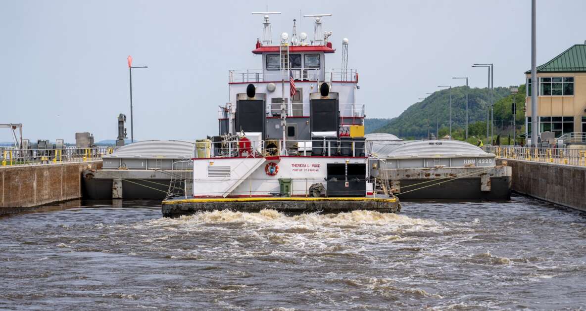 The tug Theresa L. Wood heads upstream after locking through Lock and Dam #8 May 17 in Genoa, Wis. The vessel was moving barges from St. Louis to Winona, Minn. The locks allow the boats to gradually adjust to changing river levels. Most towboats can push 15 barges at a time on the river. When those barges reach a 600-foot long lock, they don’t fit. Instead, they have to be split up, which takes more than twice as long.It was constructed and was put into operation by April 1937. (Mark Hoffman/Milwaukee Journal Sentinel)