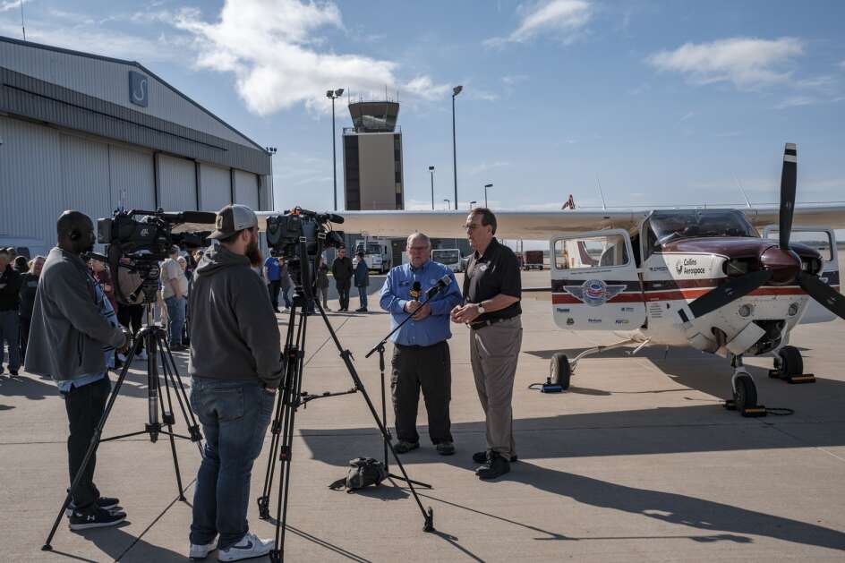 Peter Teahen of Robins and John Ockenfels of Shueyville speak with media and supporters prior to their departure from The Eastern Iowa Airport in Cedar Rapids on Friday. Teahen and Ockenfels are flying around the world to raise money and awareness for polio eradication. (Nick Rohlman/The Gazette)
