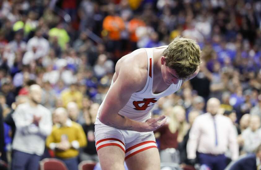 Ben Kueter takes a bow as undefeated, 4-time Iowa high school wrestling state champion