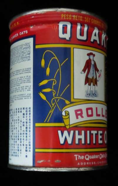 This is a side view of the Quaker Oats Rolled White Oats tin owned by Sandra Hudson of Iowa City. She, along with history columnists Jessica and Rob Cline, are attempting to discover the history of the tin -- when it was produced, where it was shipped, why instructions are given in six languages on the back. (Sandra Hudson) 