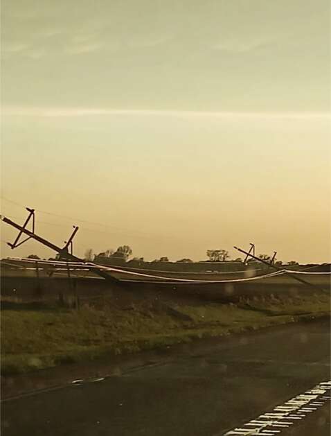 Muscatine County provided this image of collapsed utility poles in West Liberty/Atalissa to the National Weather Service's Quad Cities bureau. (National Weather Service)