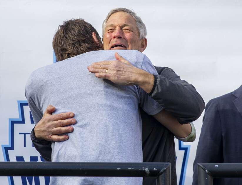 Iowa football Head Coach Kirk Ferentz becomes emotional as he hugs Iowa Hawkeyes defensive back Riley Moss (33) during the trophy ceremony at the Music City Bowl at Nissan Stadium in Nashville, Tennessee on Saturday, December 31, 2022. (Savannah Blake/The Gazette)