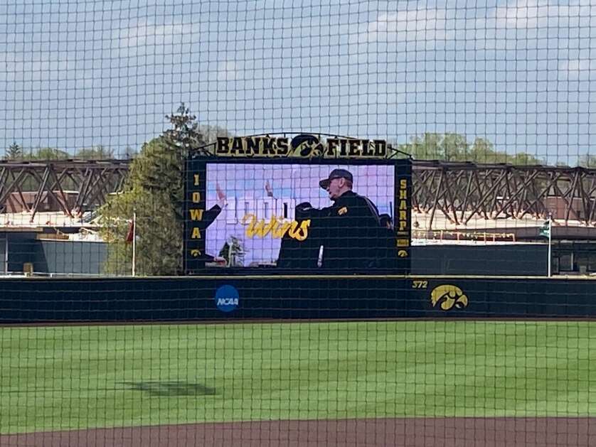 The scoreboard at Banks Field plays a tribute video for Iowa Hawkeyes head baseball coach Rick Heller, who picked up his 1,000th-career victory Saturday. Iowa beat Ohio State, 15-3.