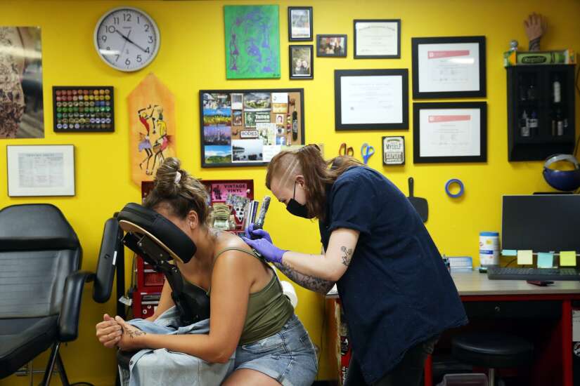 Tattoo shops in Cedar Rapids, Iowa City in high demand, filling up schedules for months 
