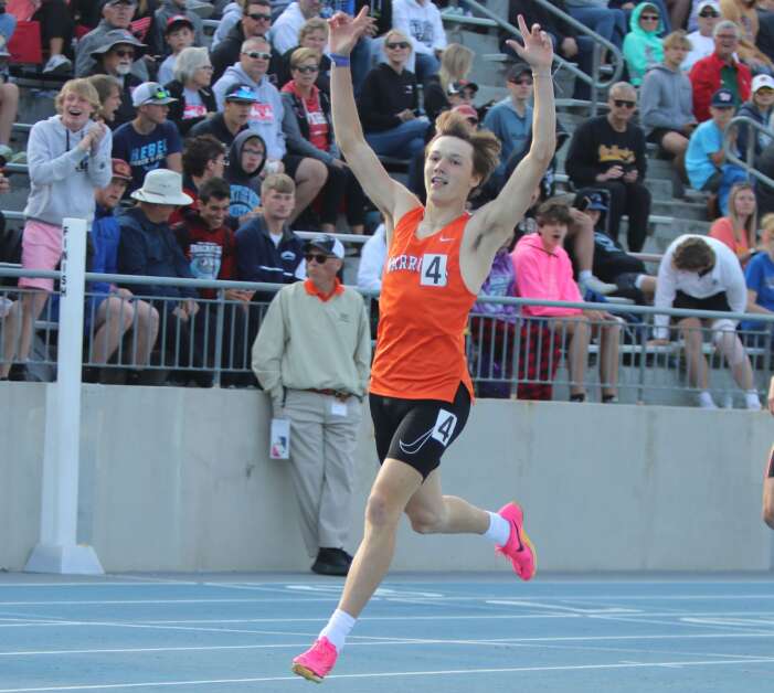 Van Buren County’s Anthony Duncan raises his hands in the air after winning the Class 2A 400 meter hurdle state title on Friday, May 19, 2023 at the Iowa High School Track and Field Championship at Drake Stadium. (Andy Krutsinger/The Union)