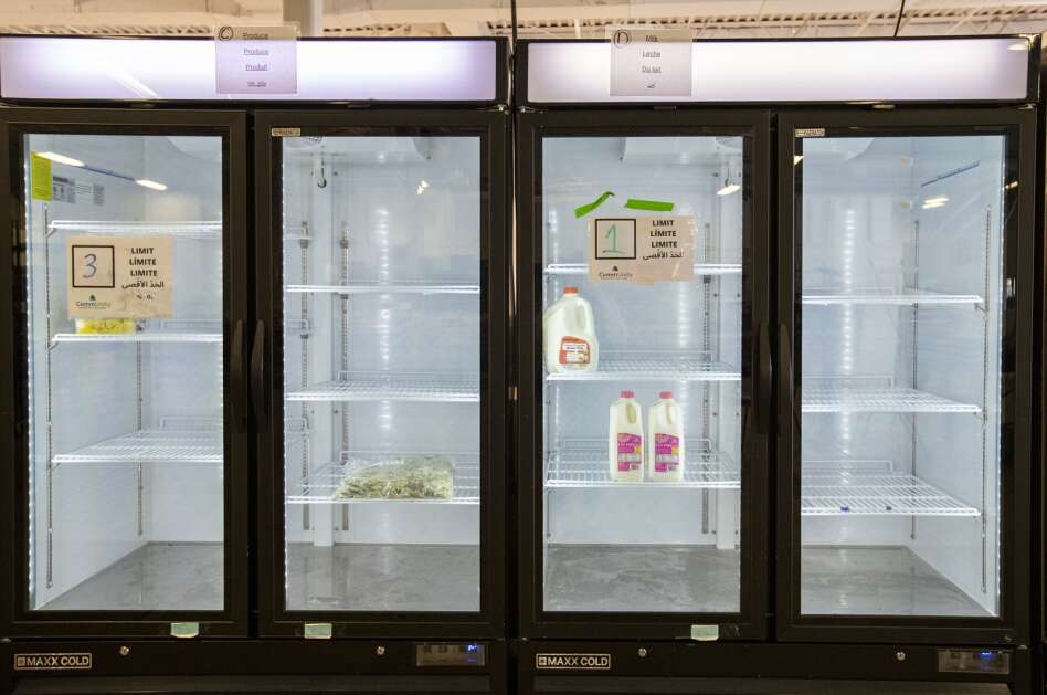 The dairy and produce shelves sit nearly empty May 16 at the CommUnity Food Bank in Iowa City. Dairy and produce products are the hardest for the food bank to secure, and shipments of those items are inconsistent. (Savannah Blake/The Gazette)