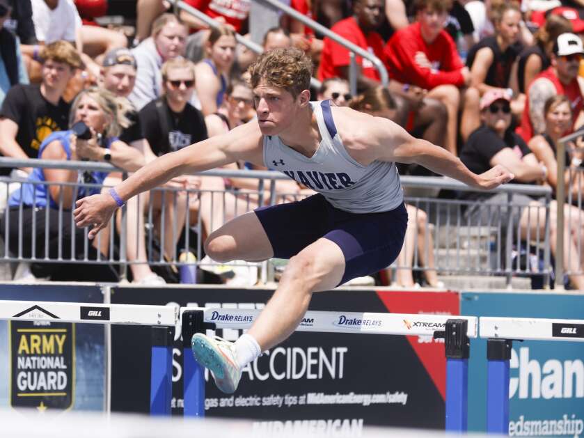 Cedar Rapids Xavier's Will Hacke clears a hurdle during the Class 3A boys’ state track and field shuttle hurdle relay Saturday at Drake Stadium in Des Moines. (Jim Slosiarek/The Gazette)