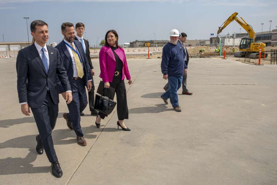 U.S. Secretary of Transportation Pete Buttigieg (left) walks past a construction site Thursday at The Eastern Iowa Airport in Cedar Rapids to review improvements funded by federal infrastructure funds.  (Nick Rohlman/The Gazette)