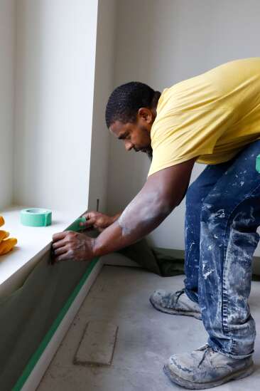 In learning construction skills, prisoners building houses for Iowans