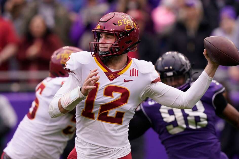 Iowa State quarterback Hunter Dekkers (12) passes as offensive lineman Darrell Simmons Jr. blocks TCU defensive lineman Dylan Horton (98) during the first quarter of an NCAA college football game in Fort Worth, Texas, Saturday, Nov. 26, 2022. (AP Photo/LM Otero)