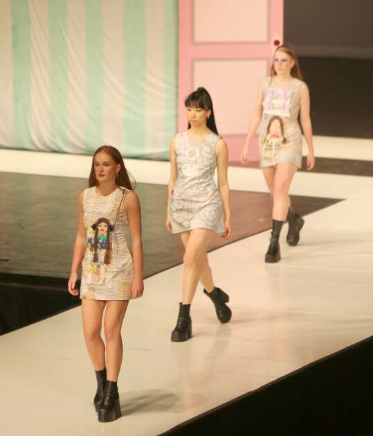 Models Aila Piech, Gabriella Saholt and Marina Jacobson model "Peanut's Routine" by Cleo Green at The Fashion Show on April 15 in Ames. (Bailey Cichon/The Gazette)