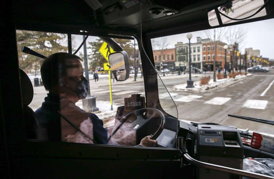 Iowa City Transit driver Scott VanScoyc drives an electric bus Jan. 27, 2022, in Iowa City. (Jim Slosiarek/The Gazette)