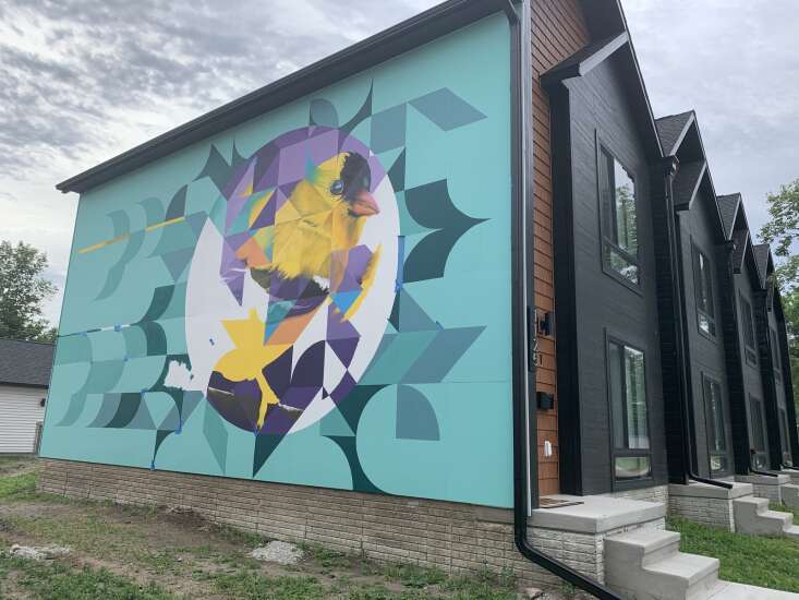 Maryland artists add two murals to Cedar Rapids’ Time Check neighborhood