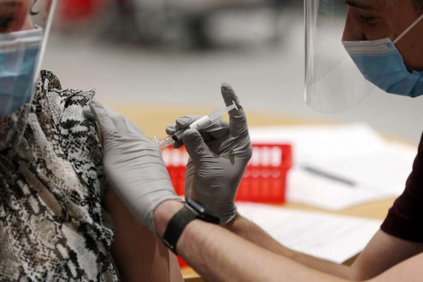 University of Iowa pharmacy students practice jabs to get vaccine certification