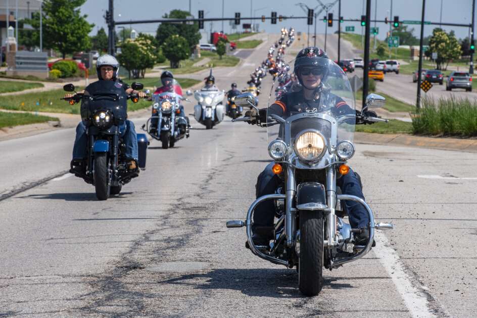 U.S. Sen. Joni Ernst (right) and former Vice President Mike Pence (left) lead a column of motorcycle riders June 3, 2023, during Ernst’s annual Roast and Ride fundraiser in Des Moines. (Nick Rohlman/The Gazette)